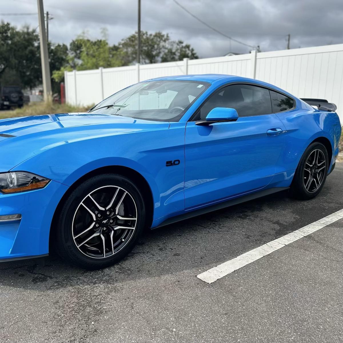 Blue Mustang with dark window tint